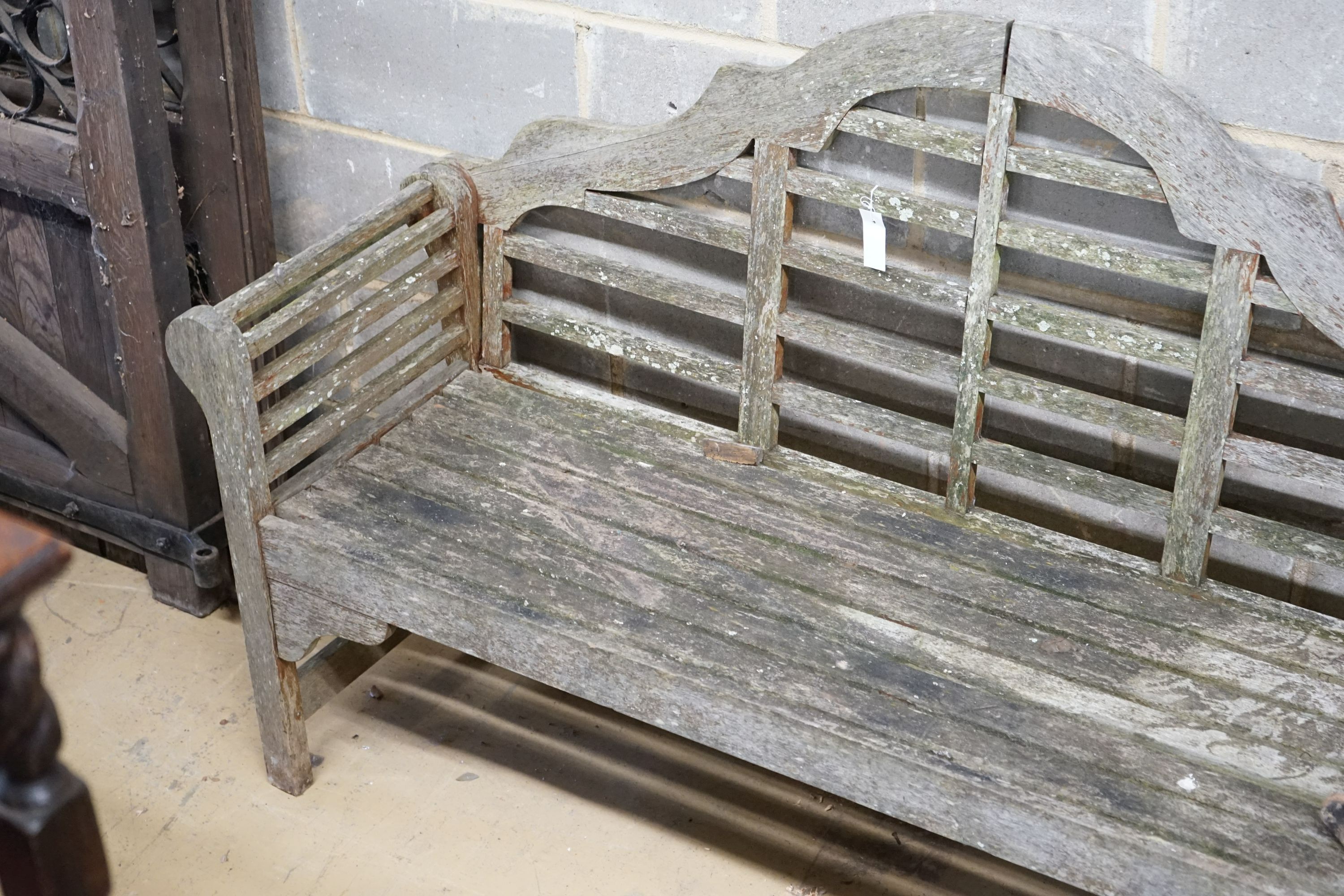 A Lutyens style teak garden bench, length 158cm, depth 51cm, height 98cm